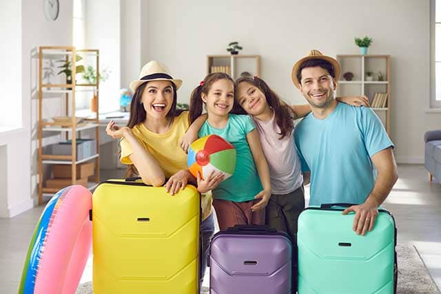 \"free-extra-guests\"/ Family getting ready for vacation saving money with free extra guests promo on NCL