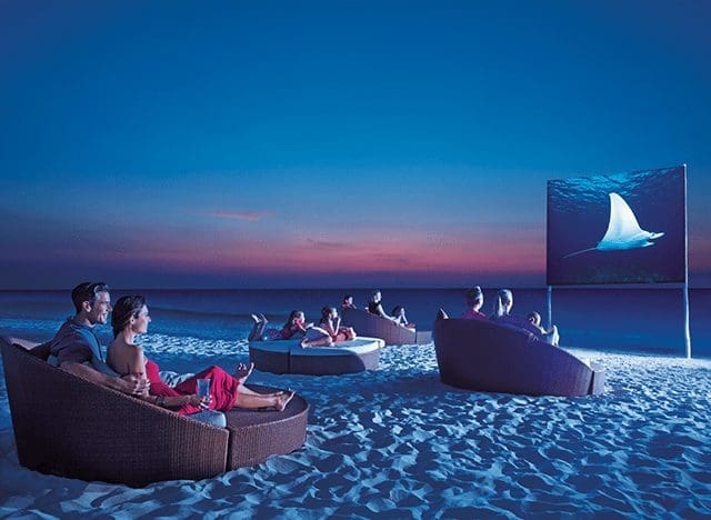 DREAMS-EC-MovieUnderStars-3-CB - JJ Travel Associates - Best Travel Agents in NJ Movie screen on the beach at Dreams Resorts