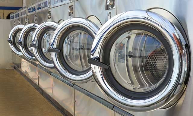 \"cruise-line-laundry\"/ Row of commercial laundry machines